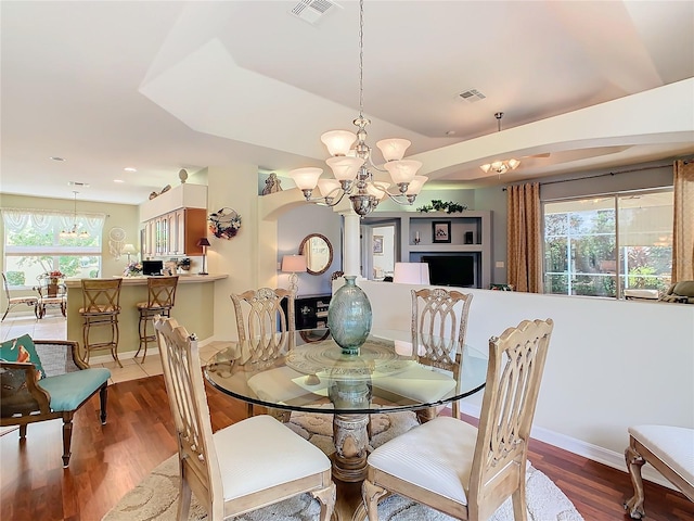 dining area featuring a chandelier and hardwood / wood-style floors