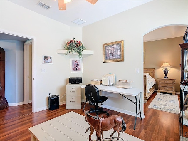 office with dark wood-type flooring and ceiling fan