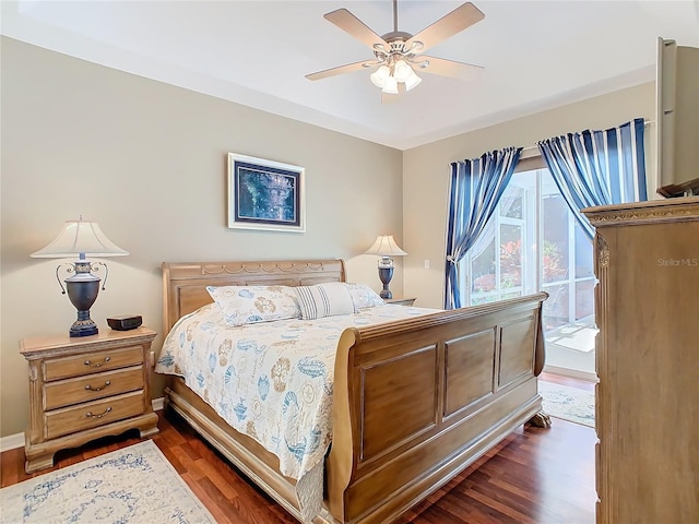 bedroom featuring ceiling fan and dark hardwood / wood-style floors