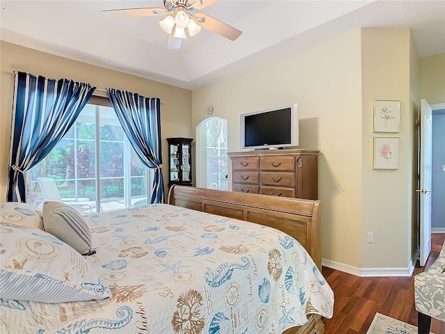 bedroom featuring access to exterior, ceiling fan, and dark hardwood / wood-style floors