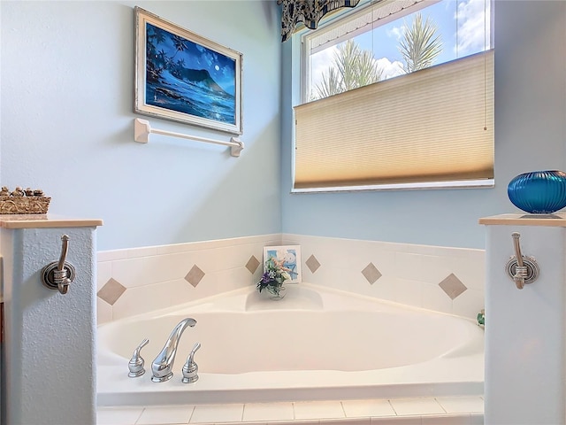 bathroom with a relaxing tiled tub