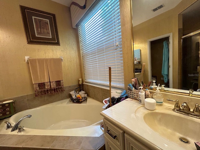 bathroom with vanity and plus walk in shower