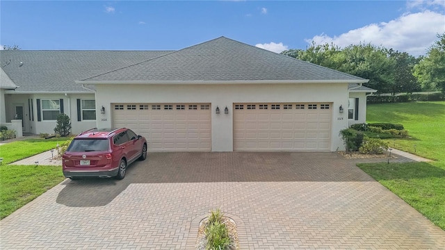 exterior space with a lawn and a garage