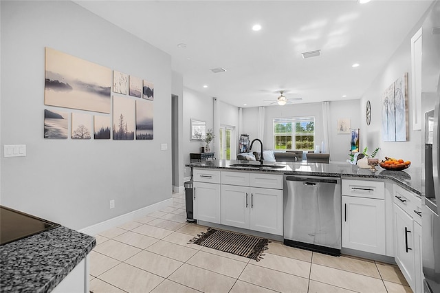 kitchen with dishwasher, sink, ceiling fan, white cabinets, and light tile patterned flooring