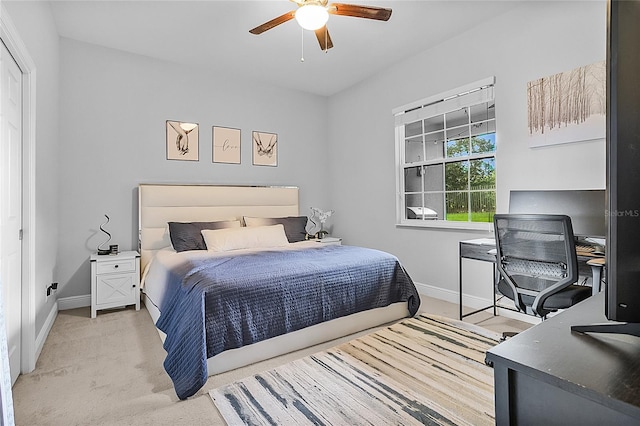 carpeted bedroom featuring ceiling fan