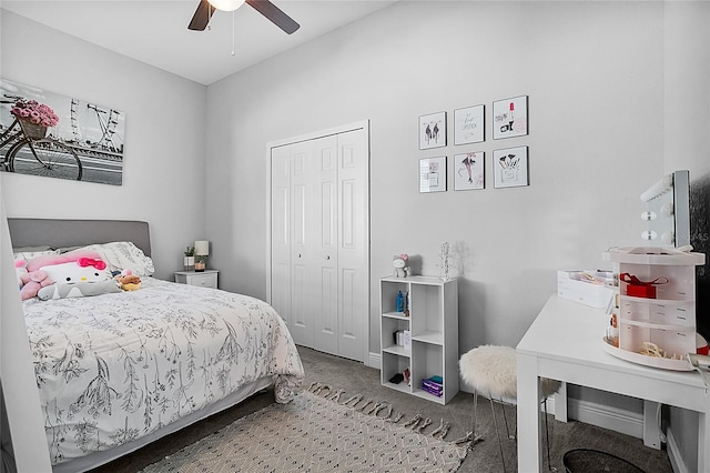 carpeted bedroom featuring ceiling fan and a closet