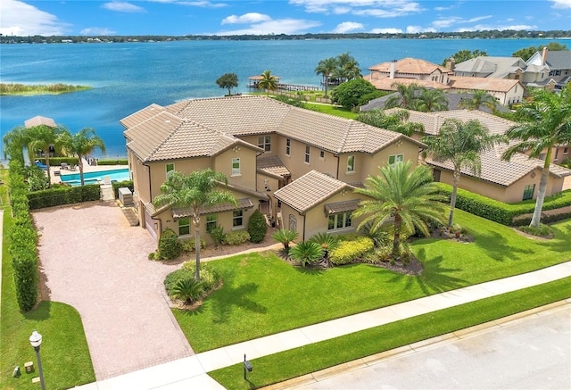 bird's eye view with a water view and a residential view