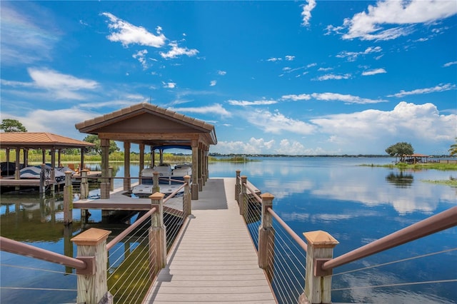 view of dock with a water view and boat lift