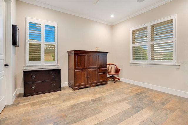 living area featuring crown molding, recessed lighting, baseboards, and light wood-style floors