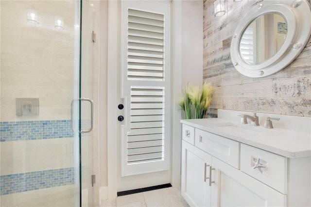 bathroom featuring a shower stall and vanity