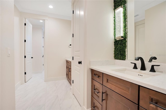 bathroom with recessed lighting, marble finish floor, crown molding, and vanity