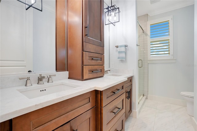 bathroom with toilet, a sink, baseboards, double vanity, and a stall shower