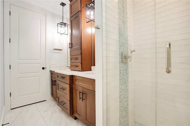 full bathroom featuring marble finish floor, crown molding, a shower stall, and vanity