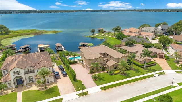 birds eye view of property featuring a water view and a residential view