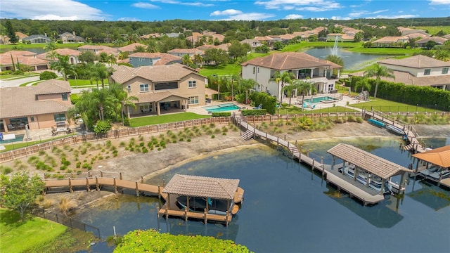 bird's eye view with a water view and a residential view