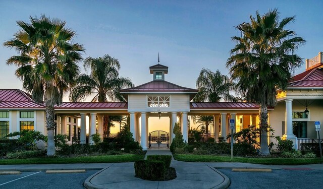 view of outdoor building at dusk