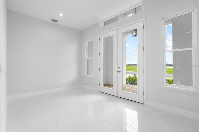 doorway to outside with french doors and plenty of natural light