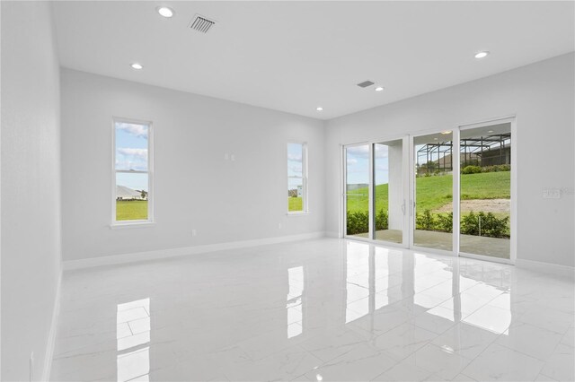 197 Valencia Ridge Dr, Auburndale, FL 33823 - empty room with baseboards, recessed lighting, and light marble finish floors