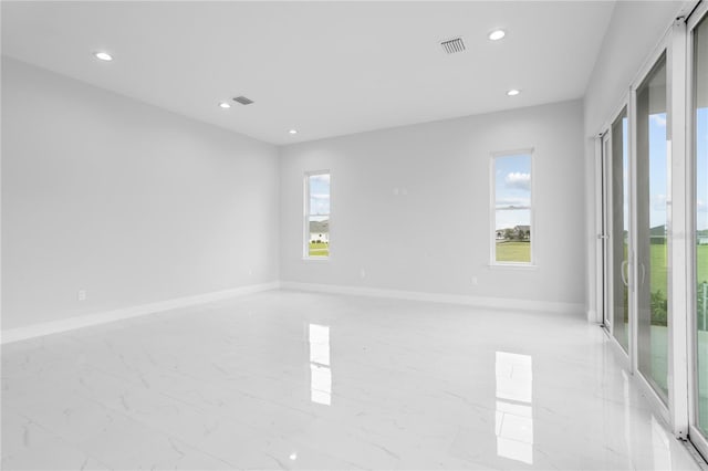 197 Valencia Ridge Dr, Auburndale, FL 33823 - unfurnished room with light marble finish floors, recessed lighting, and baseboards