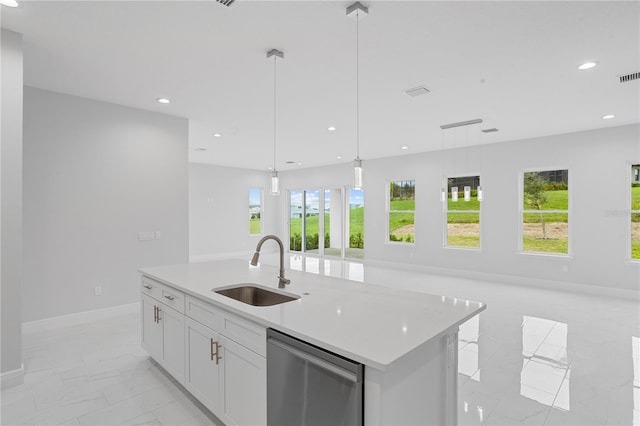 kitchen featuring dishwasher, sink, hanging light fixtures, white cabinets, and a kitchen island with sink