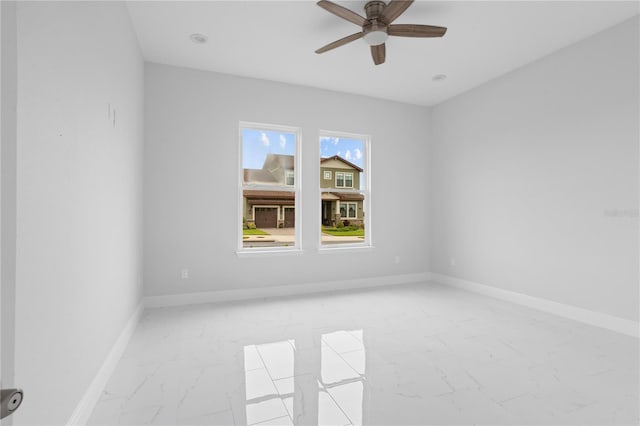 spare room with ceiling fan