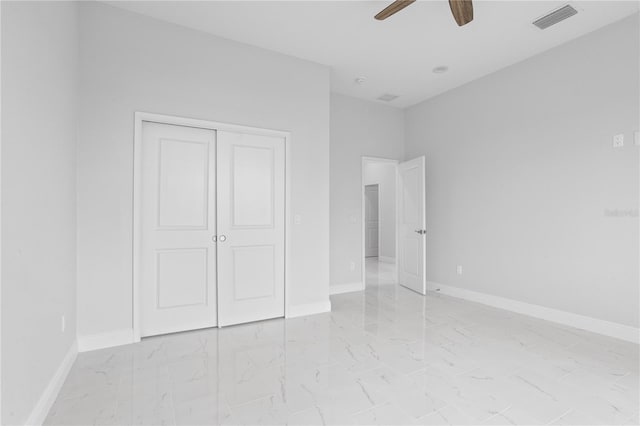 unfurnished bedroom with a closet and ceiling fan