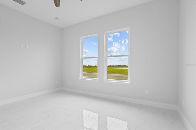 197 Valencia Ridge Dr, Auburndale, FL 33823 - spare room featuring light marble finish floors, baseboards, and a ceiling fan