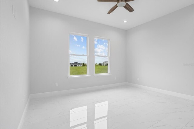 197 Valencia Ridge Dr, Auburndale, FL 33823 - spare room featuring light marble finish floors, a ceiling fan, recessed lighting, and baseboards