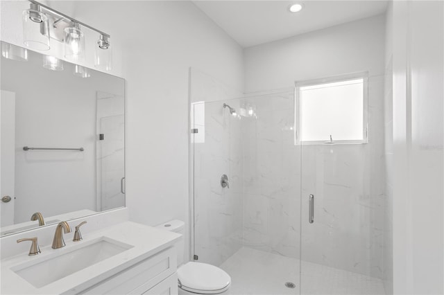 bathroom with vanity, toilet, and walk in shower