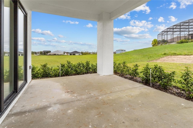 view of patio / terrace featuring a lanai