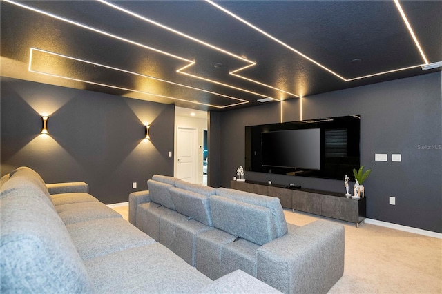 home theater room featuring carpet and baseboards