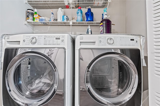 clothes washing area featuring washer and dryer