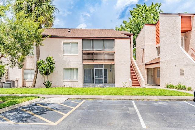 view of building exterior featuring central AC