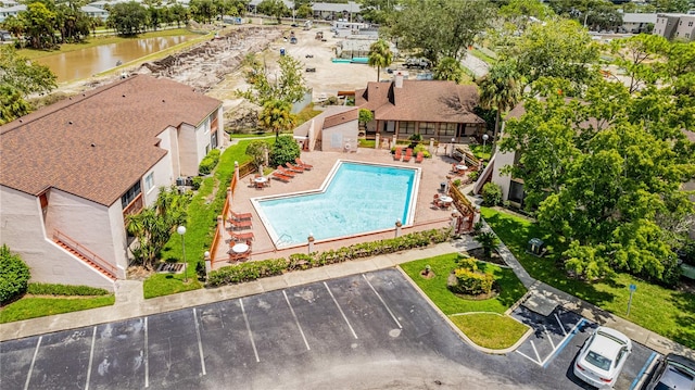 birds eye view of property featuring a water view