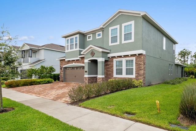 view of front facade with a garage and a front lawn