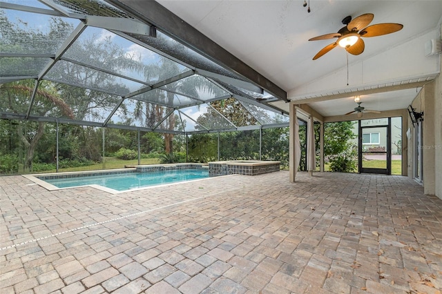 view of pool with a hot tub, a patio, and glass enclosure