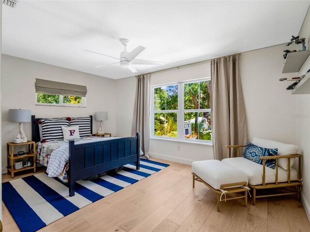 bedroom featuring ceiling fan and light hardwood / wood-style flooring