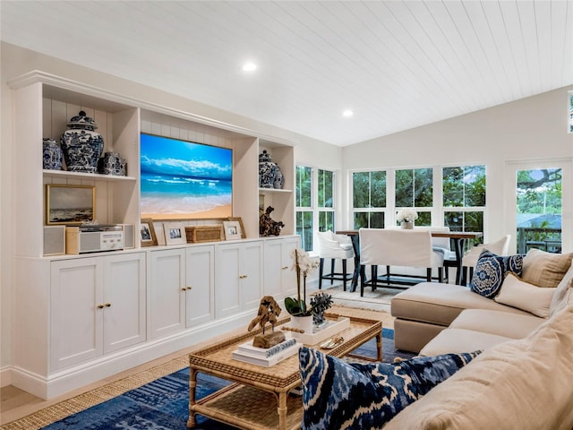 living room featuring hardwood / wood-style flooring, vaulted ceiling, and wooden ceiling