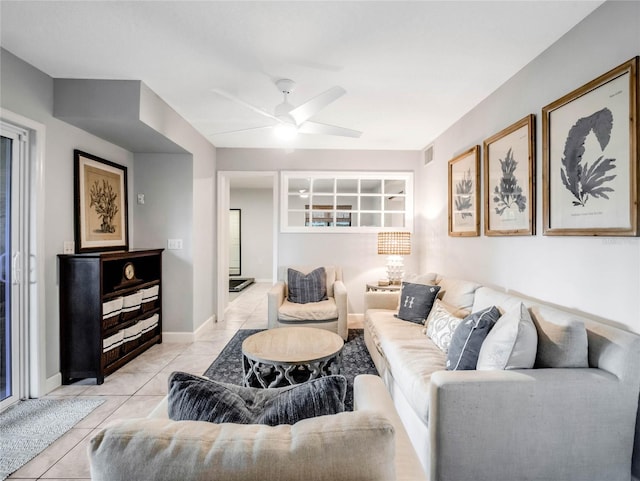 tiled living room featuring ceiling fan