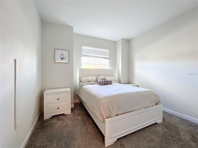 bedroom featuring dark colored carpet