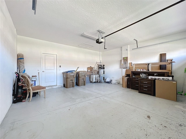 garage featuring a garage door opener, electric panel, and water heater