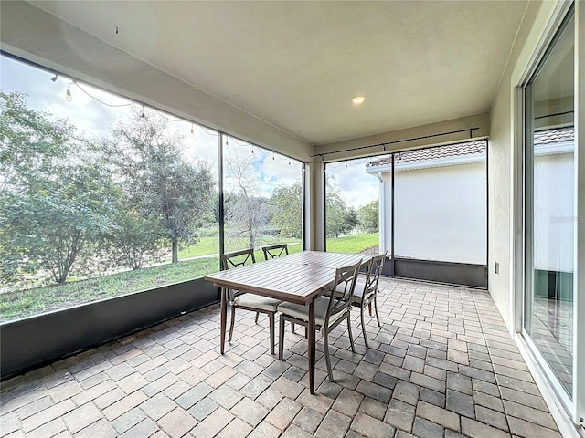 sunroom / solarium with a wealth of natural light