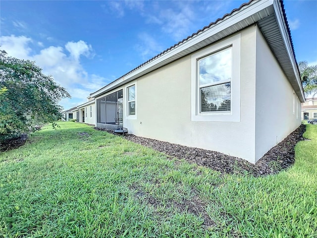 view of property exterior with a lawn