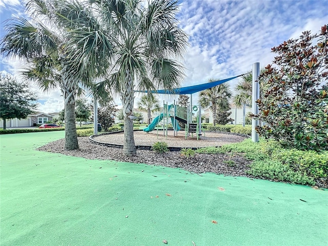 view of property's community with a playground