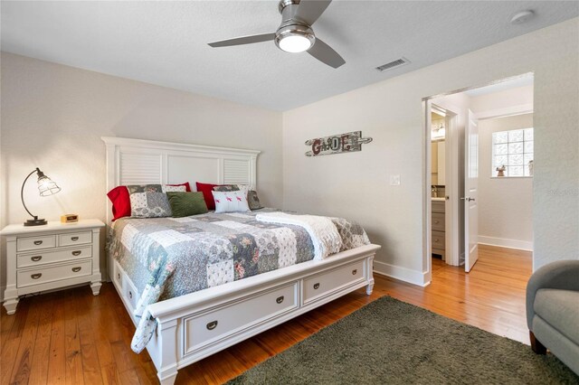 bedroom featuring dark hardwood / wood-style floors and ceiling fan