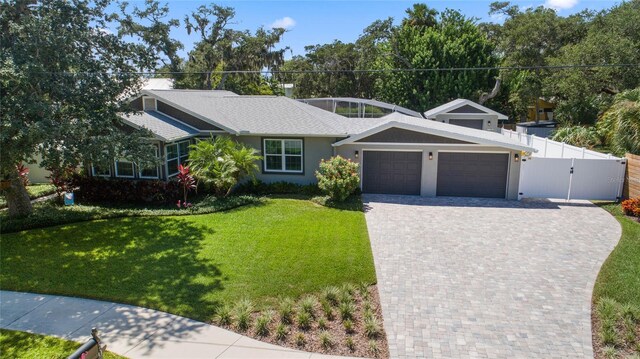 ranch-style house with a front lawn and a garage