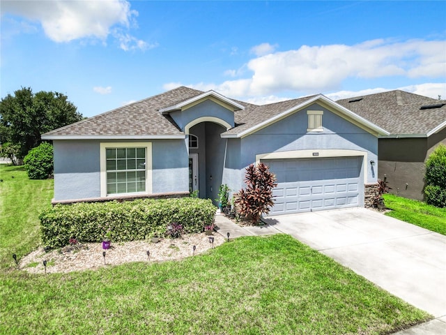 single story home with a garage and a front yard