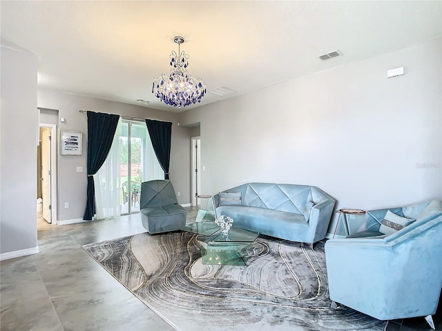 living room featuring concrete flooring and a notable chandelier