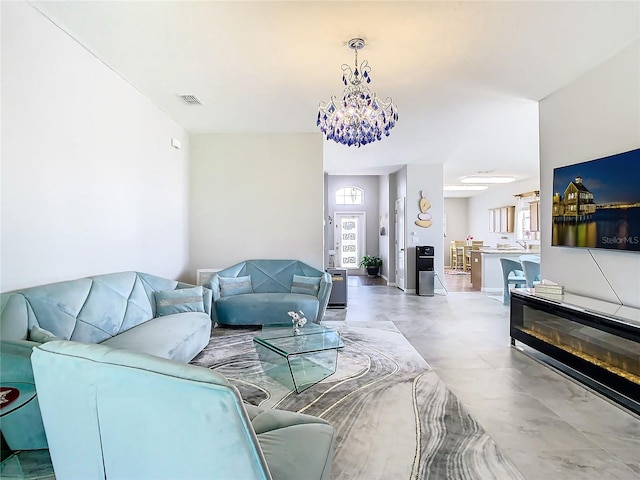 living room with a notable chandelier