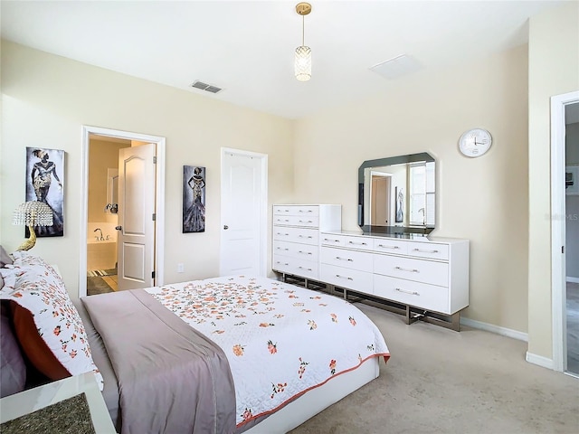 carpeted bedroom with ensuite bathroom